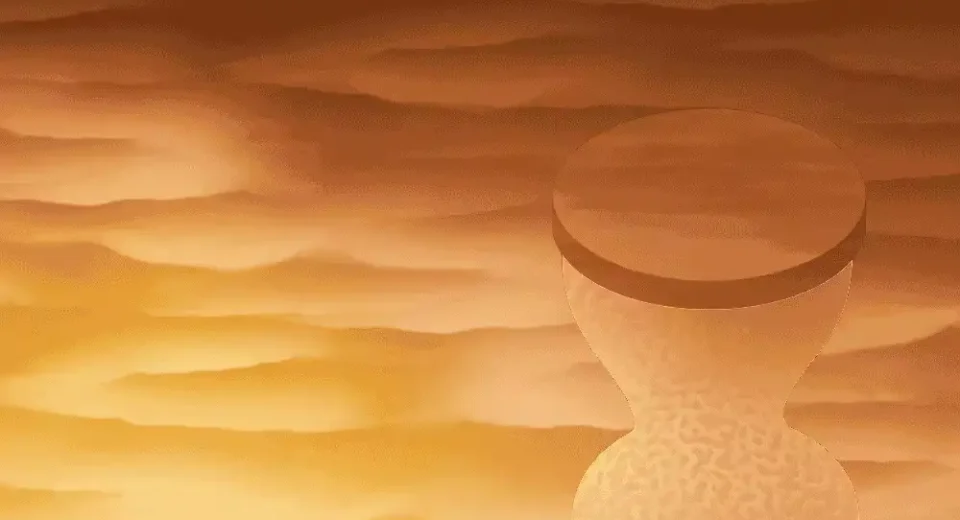 An hourglass on a cloudy background.