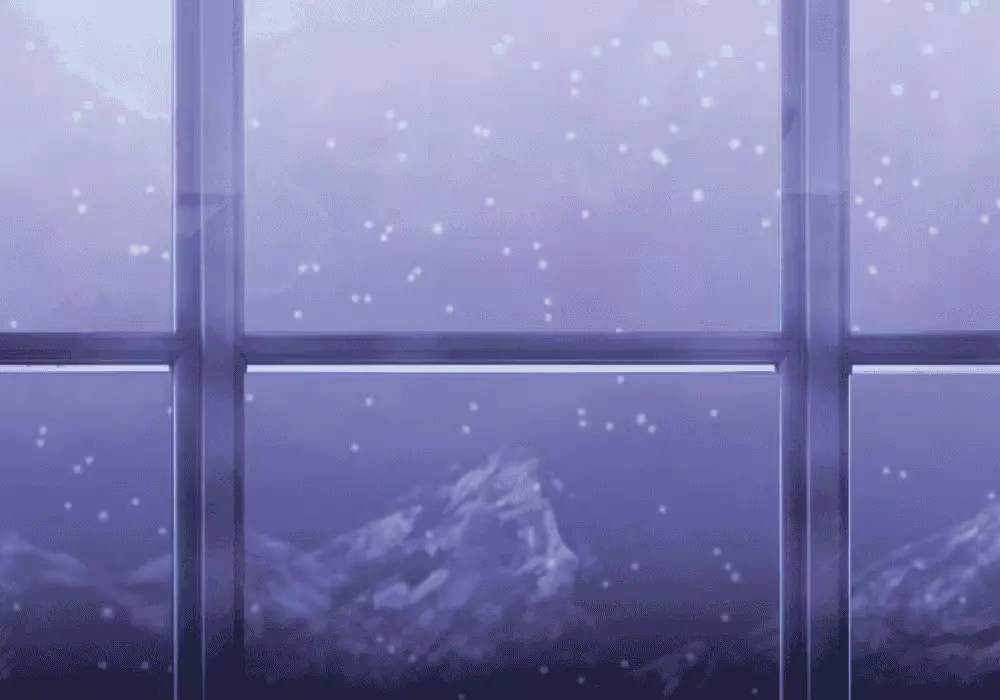 Window view of mountains with snow falling.